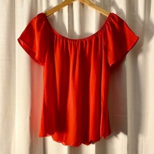 Red off the shoulder blouse.
